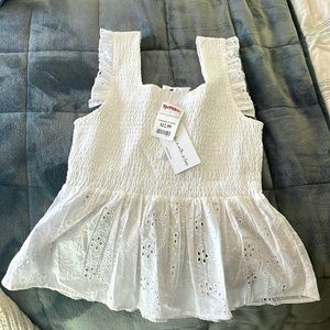 This has never been worn, tags still on it, perfect condition.